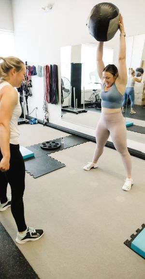 UPLIFT fitness class members warming up