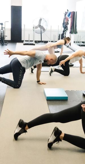 UPLIFT fitness class members warming up